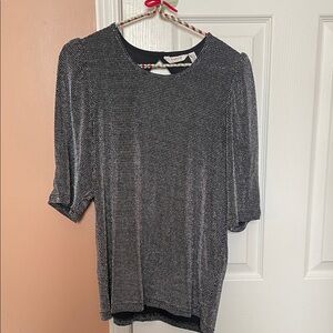 B. Young Black and Silver top